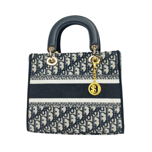 Borsa Lady Dior blu navy e bianca con manici neri per lavoro