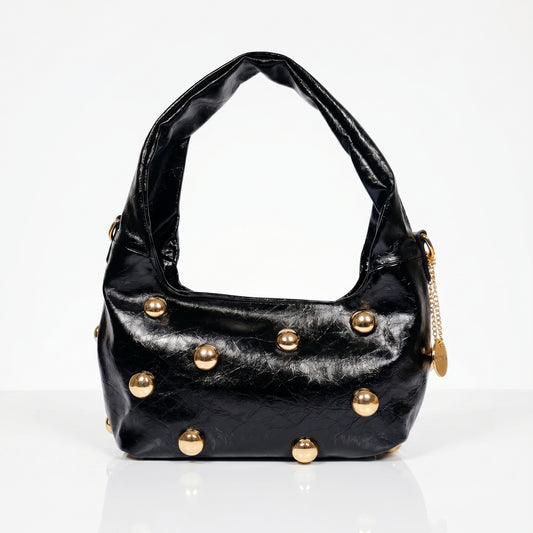 Borsa hobo Coconuda nera ecopelle con borchie sferiche dorate - vista laterale