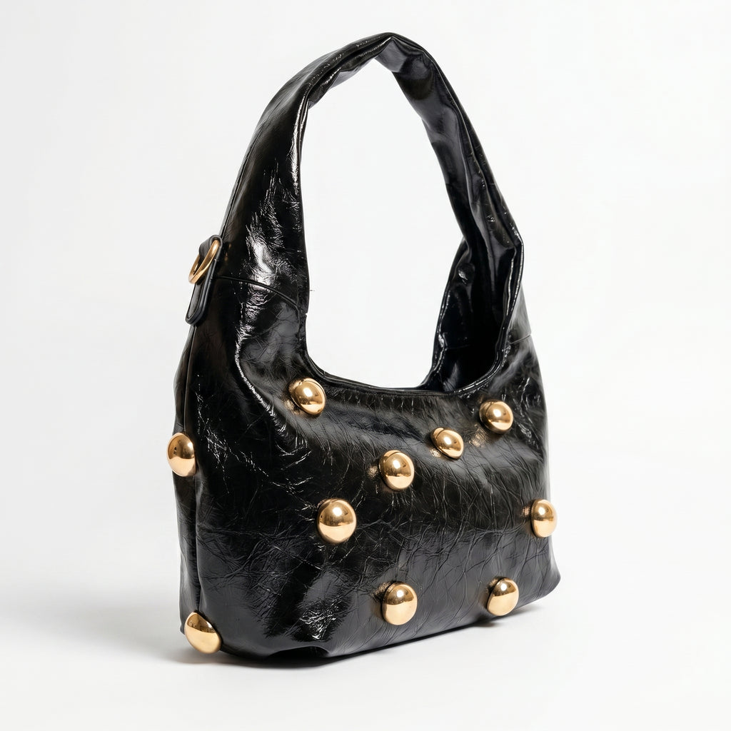 Borsa hobo Coconuda nera con borchie oversize dorate - dettaglio