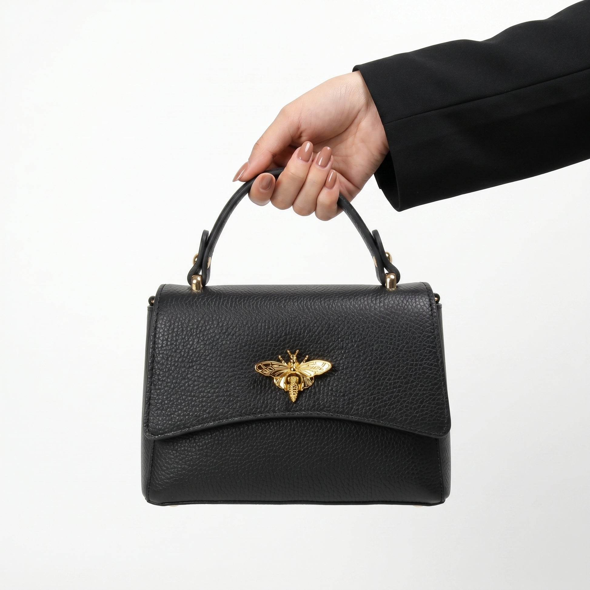 Mini borsa a farfalla vera pelle bianca – dettaglio manico