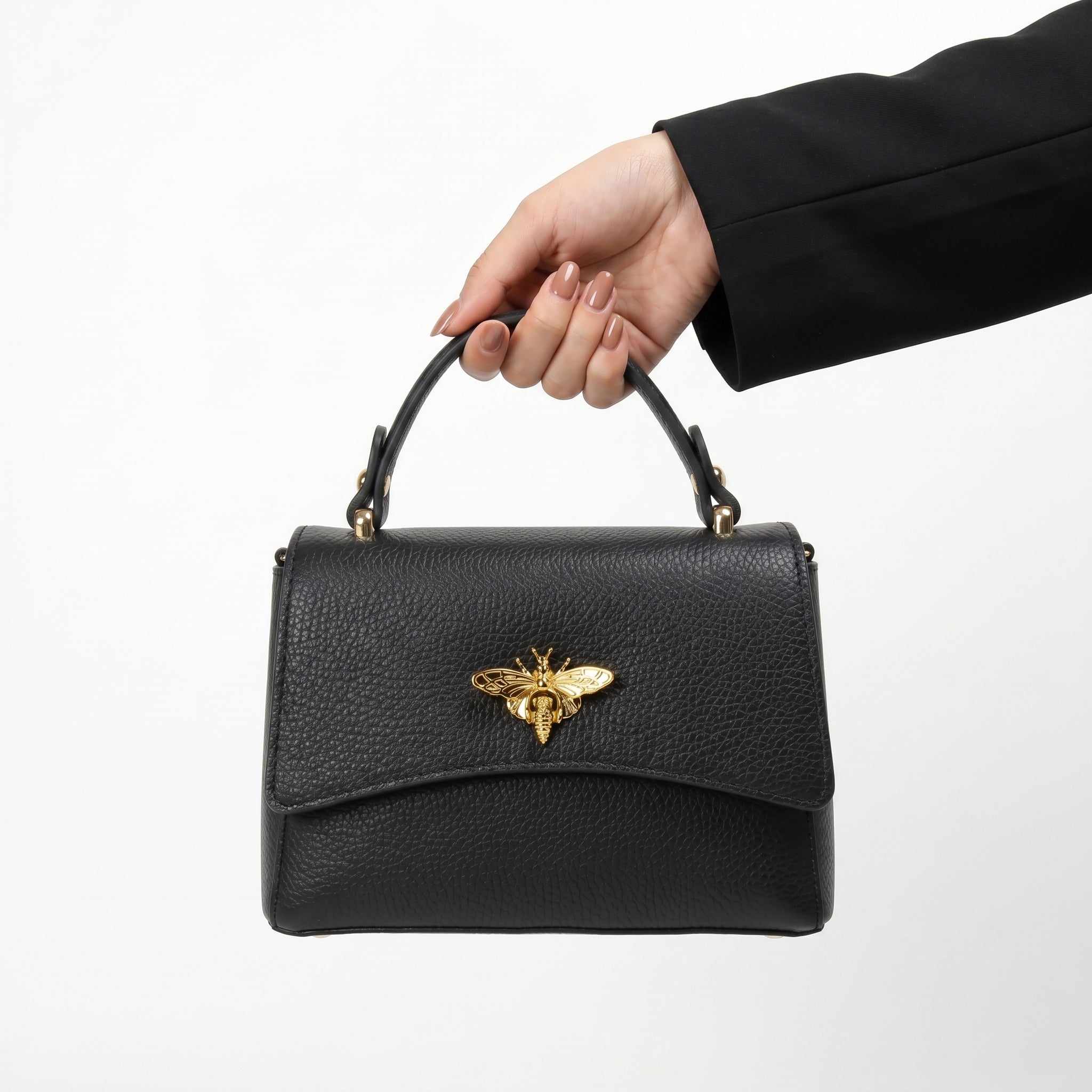Mini borsa a farfalla vera pelle bianca – dettaglio manico