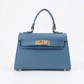Mini Beky borsa vera pelle blu con tracolla regolabile e chiusura rotante donna – vista frontale