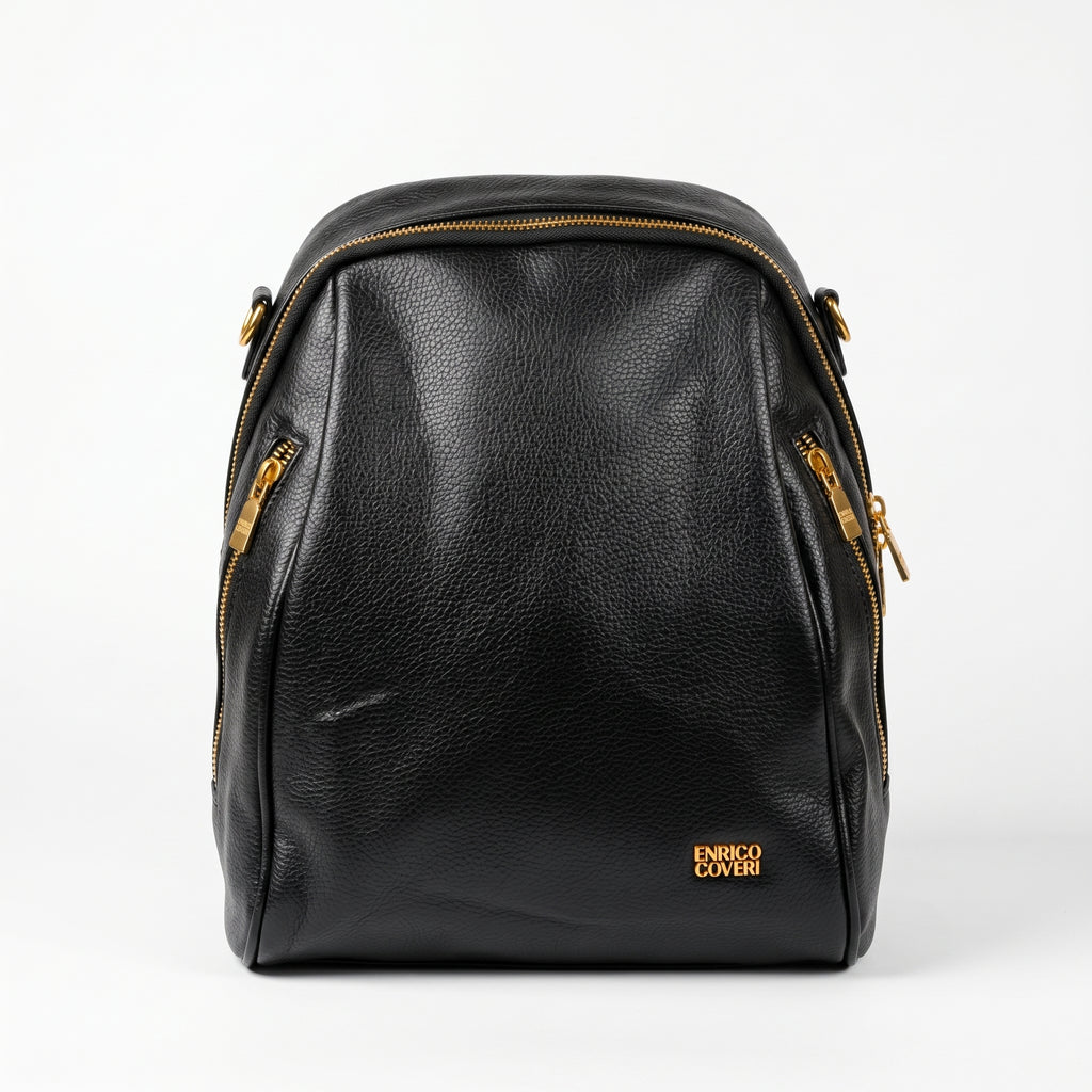Black leather backpack with gold zippers on a white background